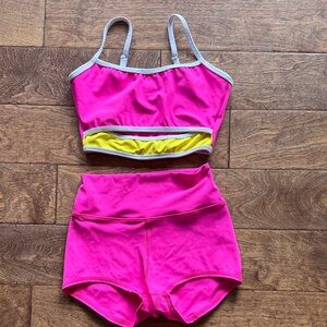 Pink Two-Piece Athletic Crop Top and High-Waist Shorts